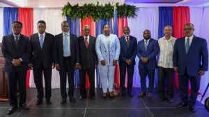 Transitional Council members pose for a group photo after a ceremony to name its president and a prime minister in Port-au-Prince, Haiti, April 30, 2024. (AP Photo/Odelyn Joseph)