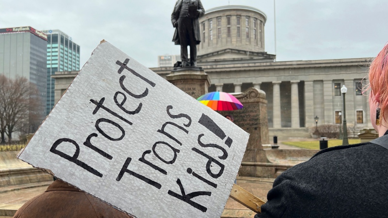 Demonstrators advocating for transgender rights and healthcare stand outside of the Ohio Statehouse on Jan. 24, 2024, in Columbus, Ohio. (AP Photo/Patrick Orsagos, File)