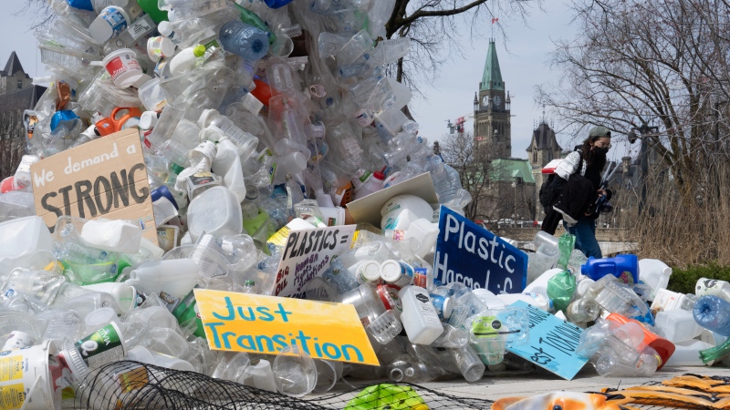 A person walks past a public art installation outside a United Nations conference on plastics on Tuesday, April 23, 2024 in Ottawa. (Source: THE CANADIAN PRESS/Adrian Wyld)