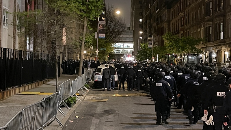 New York police officers move towards an entrance to Columbia University, Tuesday, April 30, 2024, in New York. After entering the campus, a contingent of police officers approached Hamilton Hall, the administration building that student protesters began occupying in the morning. (AP Photo/Julius Motal)