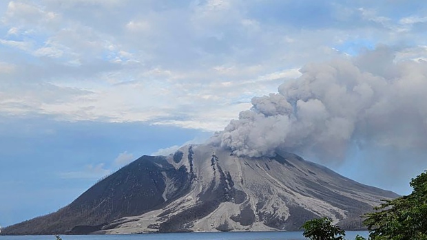 In this photo released by the Vulcanology and Geological Disaster Mitigation Center (PVMBG) of the Indonesian Ministry of Energy and Mineral Resources, Mount Ruang releases volcanic materials during its eruption on Wednesday, May 1, 2024, on Sulawesi Island, Indonesia. (PVMBG via AP Photo)
