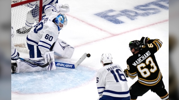 Toronto Maple Leafs goaltender Joseph Woll (60) makes a stick save against Boston Bruins left wing Brad Marchand (63) during the second period of Game 5 of an NHL hockey Stanley Cup first-round playoff series, Tuesday, April 30, 2024, in Boston. (AP Photo/Charles Krupa)