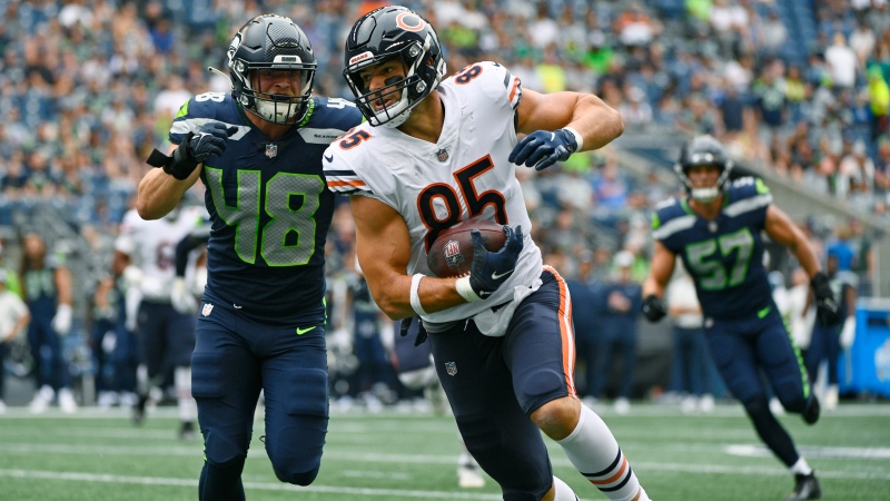 Seattle Seahawks linebacker Joel Dublanko, left, chases down Chicago Bears tight end Cole Kmet on Aug. 18, 2022, during preseason NFL action in Seattle. (Caean Couto/The Associated Press)