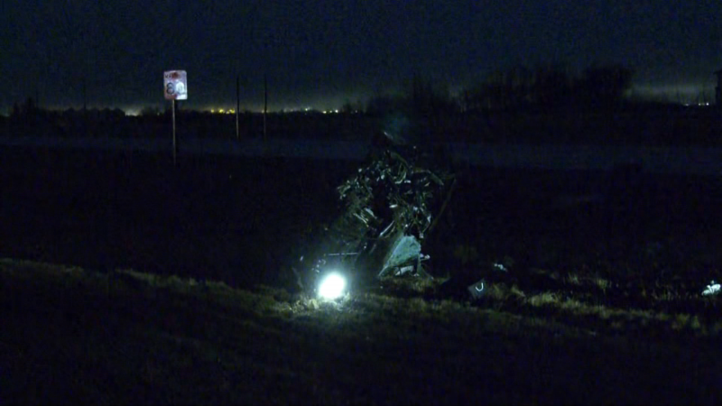 According to police, the driver of a Jeep Grand Cherokee hit the trailer of a semi parked on northbound Manning Drive and flipped twice before coming to a stop on its side in the median the early morning of May 1, 2024. (Evan Klippenstein / CTV News Edmonton) 
