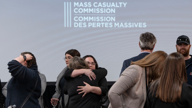 Family, friends and supporters of the victims of the mass killings in rural Nova Scotia in 2020 gather following the release of the Mass Casualty Commission inquiry's final report in Truro, N.S. on Thursday, March 30, 2023. THE CANADIAN PRESS/Darren Calabrese 