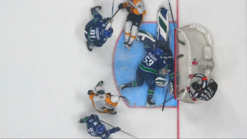 Canucks scramble in front of their net during Game 5 against the Nashville Predators on April 30, 2024.