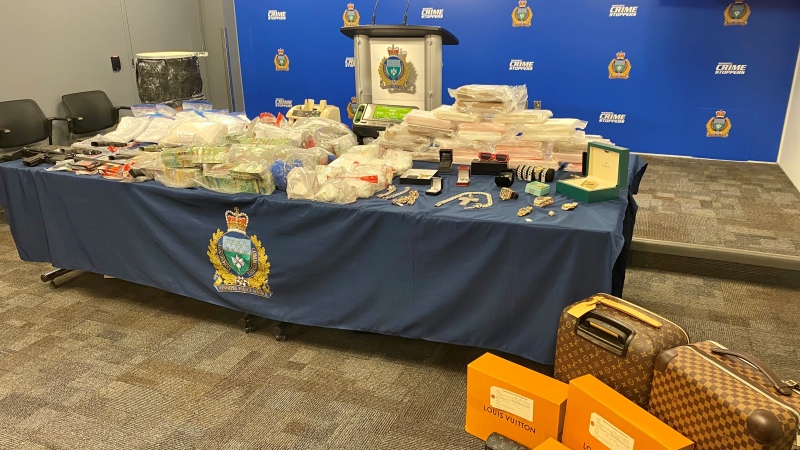 Drugs, guns and proceeds of crime seized during "Project Soft Landing" are on display at Winnipeg Police Headquarters on May 1, 2024. (Scott Andersson/CTV News Winnipeg)