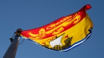 New Brunswick's provincial flag flies in Ottawa on Monday July 6, 2020. (Source: THE CANADIAN PRESS/Adrian Wyld)