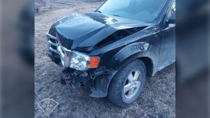 Black Ford with front end damage after accused impaired driver hit hydro pole in Cochrane, Ont. April 26, 2024 (Ontario Provincial Police)