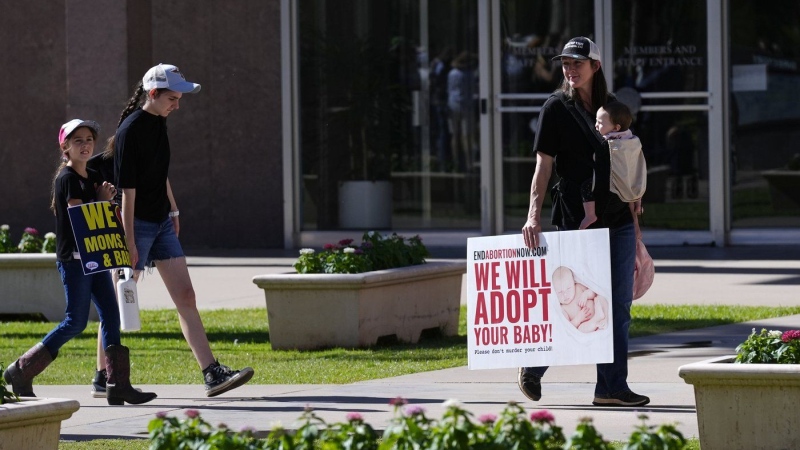 Pro-life demonstrators walk in the front of the Arizona Capitol on April 24, 2024. (Ross D. Franklin/AP Photo)