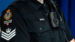 A Vancouver Police Officer is seen during a news conference from the B.C. Association of Chiefs of Police about implementing body-worn cameras for officers, in Surrey, B.C., on Thursday, Jan. 11, 2024. THE CANADIAN PRESS/Ethan Cairns