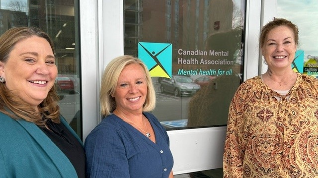 From left: Beth King, fund development manager for CMHA Waterloo Wellington, Helen Fishbourn, CEO of CMHA Waterloo Wellington and client Vanessa Dreyer.