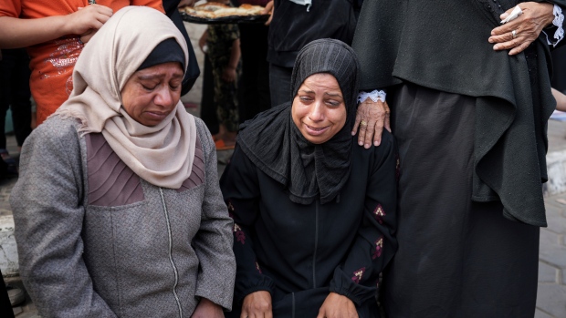 Mourners react next to the bodies of Palestinians who were killed in an Israeli airstrike in Gaza Stirp, at the Al Aqsa hospital in Deir al Balah, Gaza, Thursday, May 2, 2024. (AP Photo/Abdel Kareem Hana)