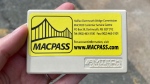 A hard-shelled MACPASS transponder is pictured.