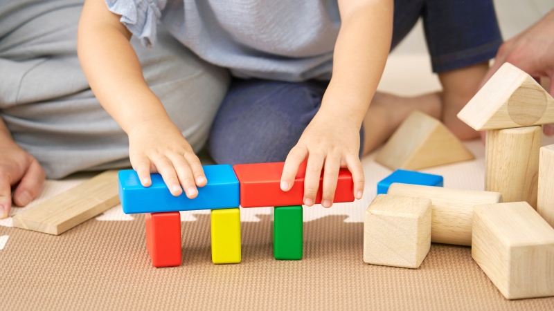 A child plays with blocks in this undated stock image. (Shutterstock)