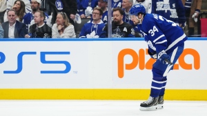 Toronto Maple Leafs' Auston Matthews (34) reacts after Boston Bruins' Brad Marchand scored an empty-net goal during third period action in Game 3 of an NHL hockey Stanley Cup first-round playoff series in Toronto on Wednesday, April 24, 2024.THE CANADIAN PRESS/Nathan Denette