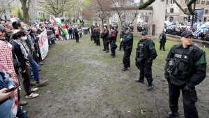 Police separate pro-Palestinian and pro-Israel demonstrators on the outskirts of a protest encampment on the grounds of McGill University, in Montreal, Thursday, May 2, 2024. (Ryan Remiorz, The Canadian Press)