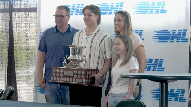 Easton Cowan of Mt. Brydges, Ont. poses with family after winning the Red Tilson Trophy as the OHL's Most Outstanding Player. (Gerry Dewan/CTV News London)