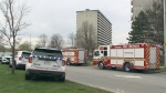 Emergency vehicles are seen outside a Donald Street apartment building where an earlier morning fire sent two children and a woman to hospital in critical condition Thursday, May 2, 2024. The Ottawa Police Arson Unit says the fire has been deemed suspicious.
