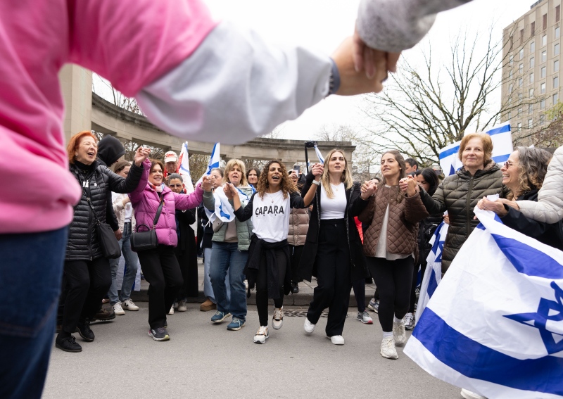 Pro-Israel demonstrators dance as they protest outside a pro-Palestinian encampment set up on McGill University's campus, in Montreal, Thursday, May 2, 2024. (Christinne Muschi, The Canadian Press)