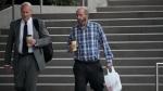 Defendant Jerry Boylan, captain of the Conception, right, arrives at Federal Court in Los Angeles, Oct. 25, 2023. (AP Photo/Damian Dovarganes, File)