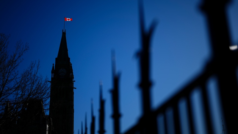 The Canada flag catches the morning light on the Peace Tower on Parliament Hill in Ottawa on Tuesday, April 16, 2024. THE CANADIAN PRESS/Sean Kilpatrick