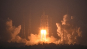 A Long March-5 rocket, carrying the Chang'e-6 spacecraft, blasts off from its launchpad at the Wenchang Space Launch Site in Wenchang, south China's Hainan Province, Friday, May 3, 2024. (Guo Cheng/Xinhua via AP)