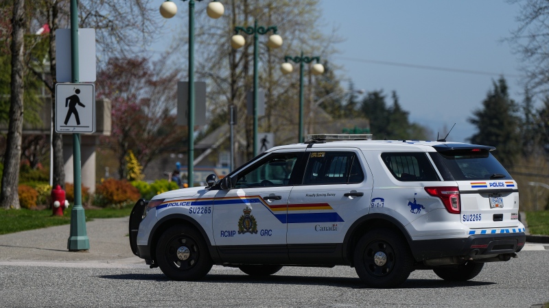 A Surrey RCMP officer drives a police vehicle in Surrey, B.C., on Friday, April 28, 2023. THE CANADIAN PRESS/Darryl Dyck