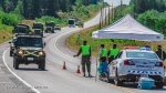 Military vehicles approach checkpoint in simulated disaster exercise. (Canadian National Defence)