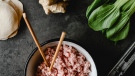 Ground pork is seen in this image as part of an array of ingredients used to make dumplings. (Credit: Eva Bronzini via Pexels)