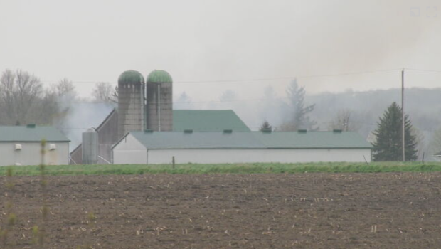 Smoke rises from a farm on Allemang Place near Three Bridges Road in Elmira on May 3, 2024. (Shelby Knox/CTV News)