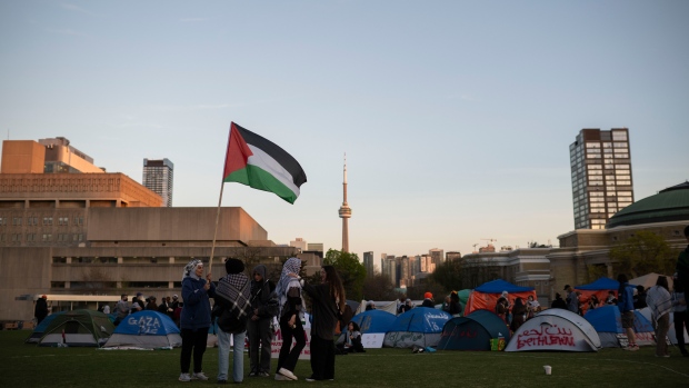 Protesters gather in an encampment set up on the University of Toronto campus in Toronto on Thursday, May 2, 2024. THE CANADIAN PRESS/Christopher Katsarov