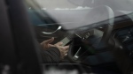A driver uses their smartphone while stopped at a traffic light in Halifax, Wednesday, Jan. 10, 2024. (Source: THE CANADIAN PRESS/Darren Calabrese)