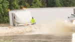 Driver scrambles out of sinking truck 