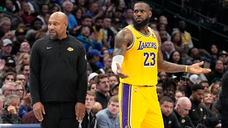 Los Angeles Lakers forward LeBron James (23) reacts to a call as head coach Darvin Ham looks on during the first half of an NBA basketball game against the Dallas Mavericks in Dallas, Tuesday, Dec. 12, 2023. (LM Otero / AP Photo)