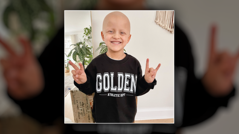 Griffin Bell, seen here in an Instagram picture from January 2023, relapsed from neuroblastoma multiple times before he died in March 2024. His and his family’s message throughout his cancer journey is seen on his shirt, reflecting their positive attitude and trying to ensure ‘it’s all golden’. (Courtesy: Instagram/littlepressco) 