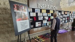 A photo gallery at a Red Dress Day event at Ottawa City Hall depicts the chronology from settlers arriving on Turtle Island in the 15th century, to the recent discovery of mass graves resulting from residential schools. May 3, 2024 (Sam Houpt/CTV News)