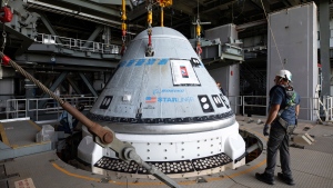 In this photo provided by NASA, the Boeing Starliner spacecraft is lifted at the Vertical Integration Facility at Space Launch Complex-41 at Cape Canaveral Space Force Station in Florida on Tuesday, April 16, 2024. (Kim Shiflett/NASA via AP)