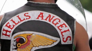 Members of the Hells Angels arrive at a property in Langley, B.C., on July 25, 2008. (Darryl Dyck, The Canadian Press)