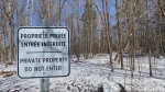 A private property sign warns residents in Hudson, Que. that they will no longer have access to Sandy Beach. 
