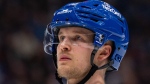 Vancouver Canucks' Elias Pettersson (40) waits for a face off during the third period of an NHL game against the Winnipeg Jets, in Vancouver, Saturday, March 9, 2024. THE CANADIAN PRESS/Ethan Cairns
