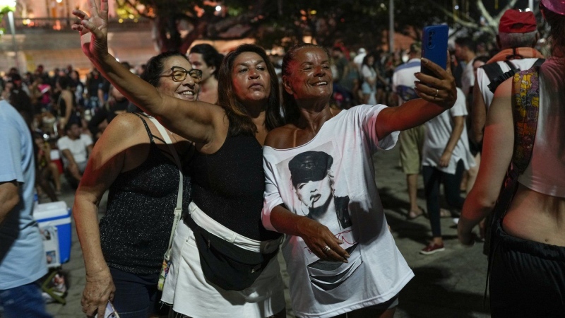 Fans take a selfie as they wait for the start of Madonna's last show of her The Celebration Tour, in Rio de Janeiro, Brazi. (Silvia Izquierdo/AP Photo)