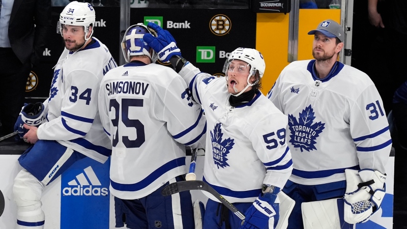 Toronto Maple Leafs' Tyler Bertuzzi (59) reaches out to Ilya Samsonov (35) after the Maple Leafs lost to the Boston Bruins in overtime during Game 7 of an NHL hockey Stanley Cup first-round playoff series, Saturday, May 4, 2024, in Boston. (AP Photo/Michael Dwyer)