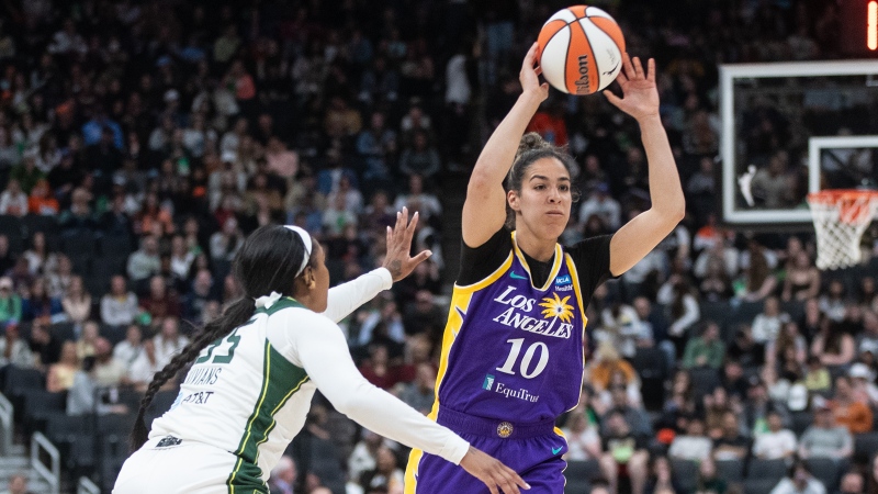 Los Angeles Sparks' Kia Nurse (10) makes the pass as Seattle Storm's Victoria Vivians (35) tries to block during second half WNBA preseason action in Edmonton on Saturday, May 4, 2024. (THE CANADIAN PRESS/Jason Franson)