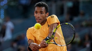 Felix Auger-Aliassime, of Canada, competes against to Andrey Rublev, of Russia, during the final match of the Madrid Open tennis tournament in Madrid, Spain, Sunday, May 5, 2024. (Manu Fernandez, The Associated Press)
