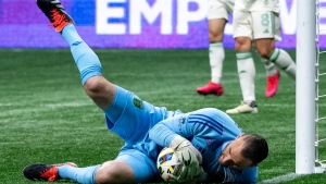 Austin FC goalkeeper Brad Stuver (1) stops the ball against the Vancouver Whitecaps during the second half of an MLS soccer match in Vancouver, on Saturday, May 4, 2024. THE CANADIAN PRESS/Ethan Cairns