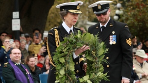 Princess Anne carries a wreath to place on the steps of the cenotaph as an act of remembrance during the Battle of the Atlantic service at the legislature, in Victoria, Sunday, May 5, 2024. THE CANADIAN PRESS/Chad Hipolito