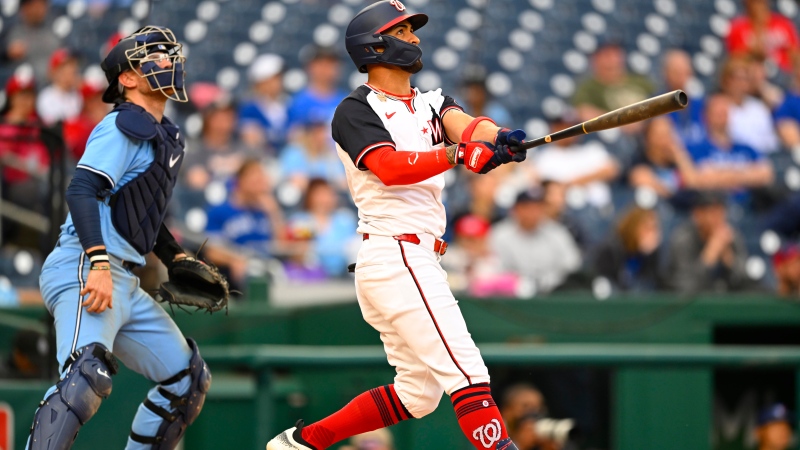 Washington Nationals' Eddie Rosario, right, watches with Toronto Blue Jays catcher Alejandro Kirk his two run go-ahead home run to right center field during the seventh inning of a baseball game, Sunday, May 5, 2024, in Washington. (AP Photo/John McDonnell)