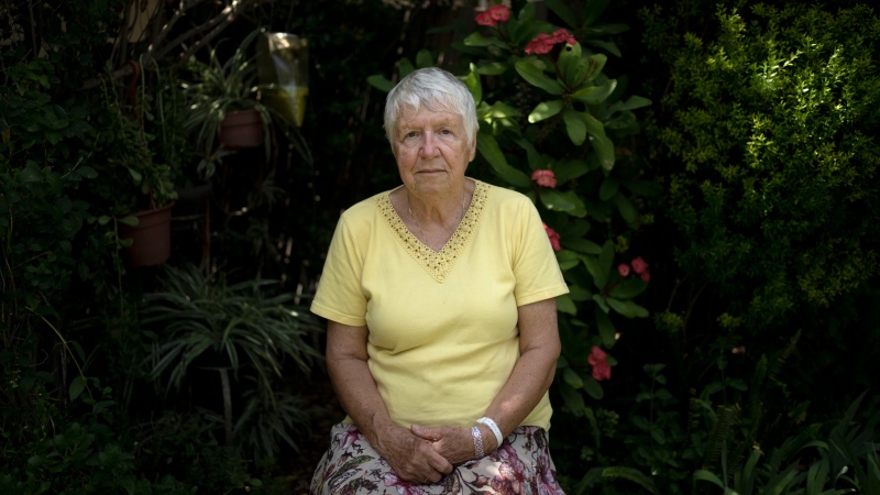 Judith Tzamir, a Holocaust survivor from Germany, poses for a portrait in her family home in Kibbutz Meflasim, southern Israel, Friday, May 3, 2024. (AP Photo/Maya Alleruzzo)