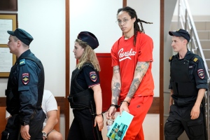WNBA star and two-time Olympic gold medalist Brittney Griner, second from right, is escorted to a courtroom for a hearing in Khimki outside Moscow, Russia, July 7, 2022. AP Photo/Alexander Zemlianichenko, File)